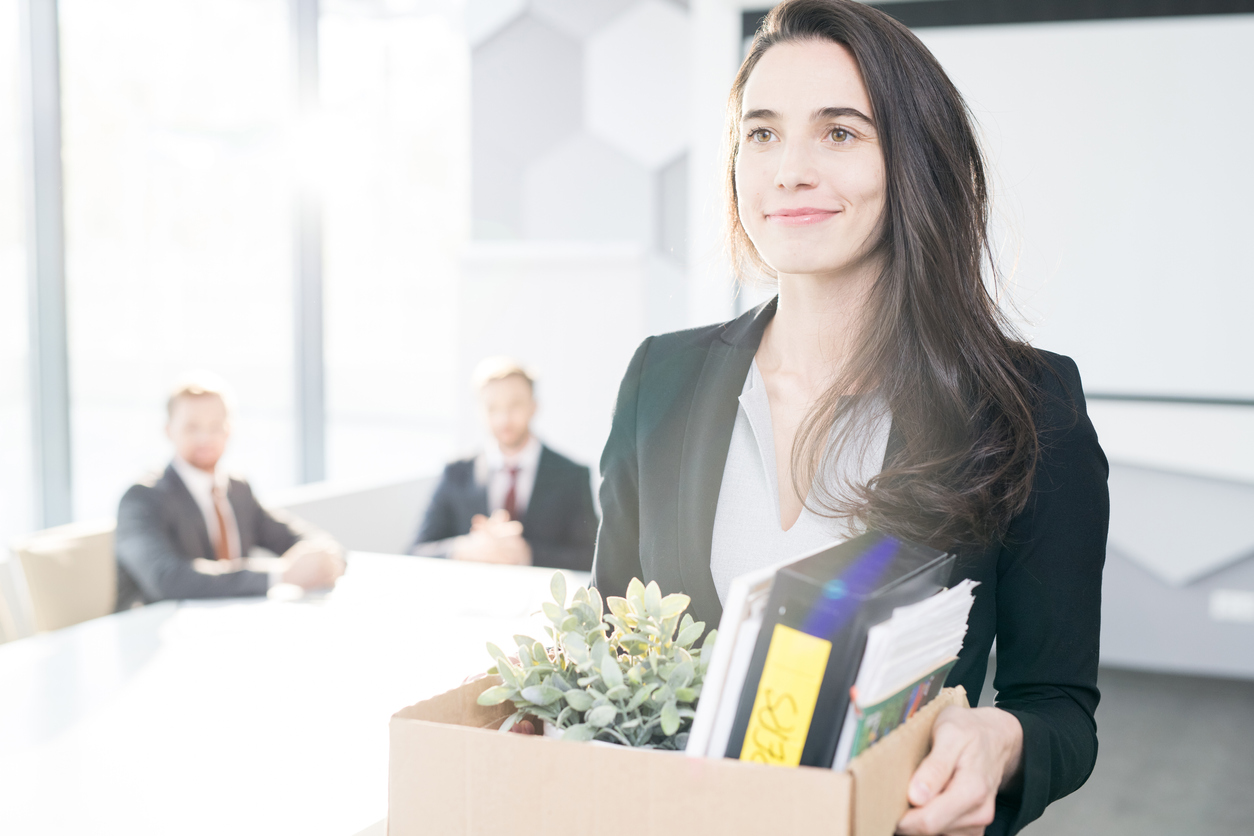Smiling businesswoman with box made the decision to switch jobs.