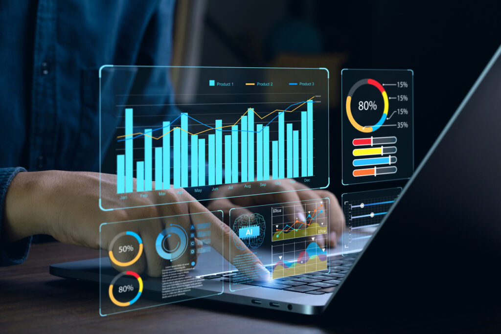 Various analytics on screen with man working on laptop illustrate the importance of data governance.