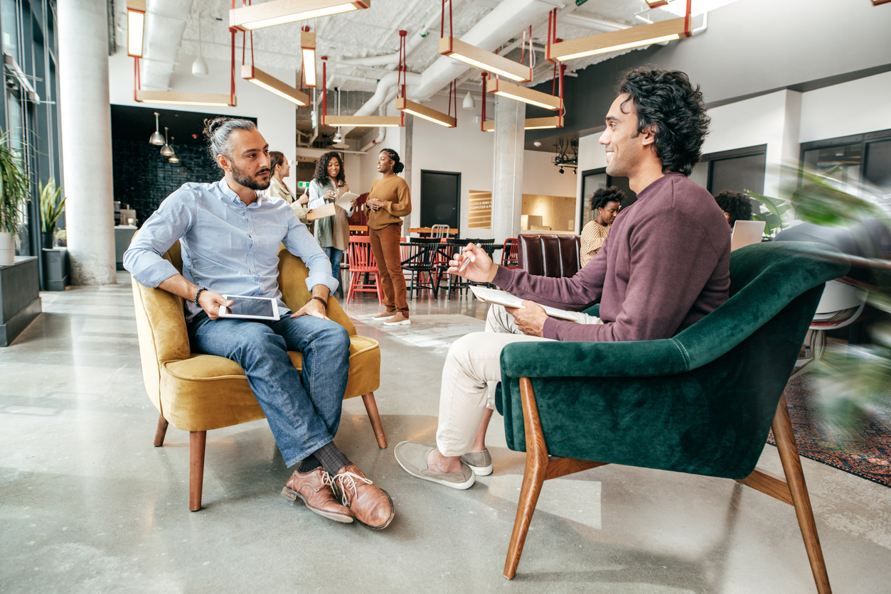 A hiring manager conducts an interview, incorporating strategy from AI recruitment tools.
