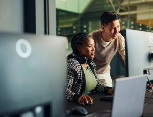 Two members of an AI workforce discuss AI strategy.